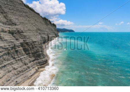 Defocused Beautiful Summer View Of The Rocks And Wild Beach In The Camp 