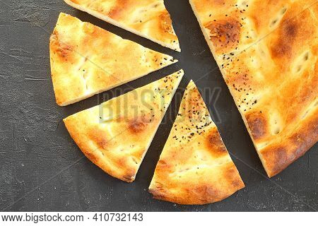 Slices Of Ramadan Pita (ramazan Pidesi) Traditional Turkish Bread For Holy Month Ramadan On Black Ba