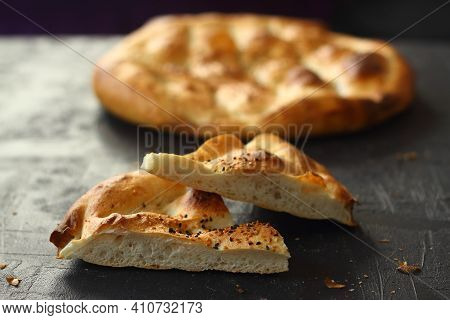 Slices Of Ramadan Pita (ramazan Pidesi) Traditional Turkish Bread For Holy Month Ramadan On Black Ba