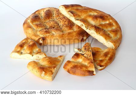 Slices Of Ramadan Pita (ramazan Pidesi) Traditional Turkish Bread For Holy Month Ramadan On White Ba