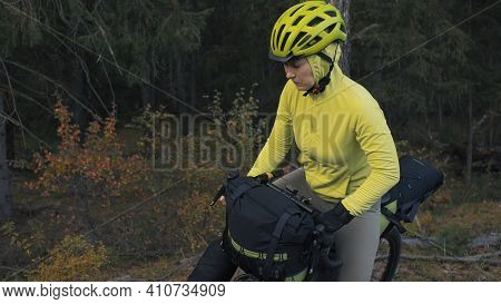 The Woman Travel On Mixed Terrain Cycle Touring With Bike Bikepacking. The Traveler Journey With Bic
