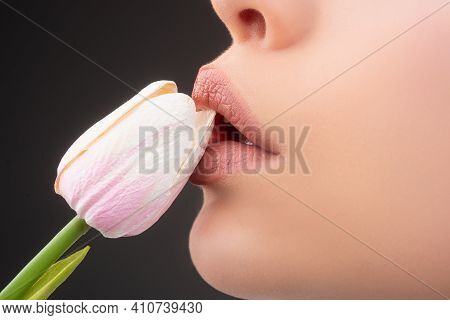 Girl Lips With Tulips. Oral Sex, Licking Flower. Blowjob And Kiss. Sensual Sexy Female Mouth And Spr