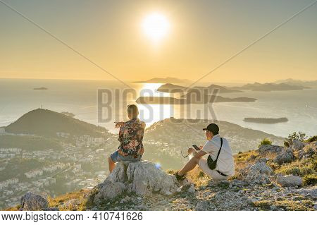 Two Males Overlooking Dubrovnik Adriatic Islands Coastline On Top Of Mountain Srd In Sunset Golden H