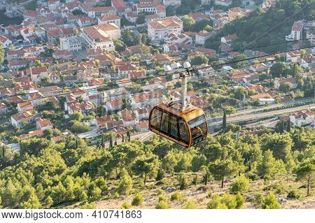 Cable Car Carriage With Tourists In Sunset Hour In The Air Up To Mount Srd From Dubrovnik In Croatia