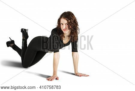 Young Beautiful Woman In Black Suit Posing Standing On All Fours In The Studio On White Background