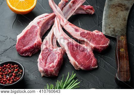 Raw Fresh Lamb Loin Chops Set, With Ingredients Carrot Orange, Herbs, On Black Stone Background