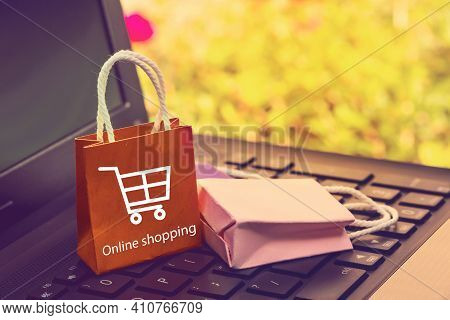 Business Concept Online Shopping, Paper Shopping Bags On Notebook Keyboard. Online Shopping E-commer