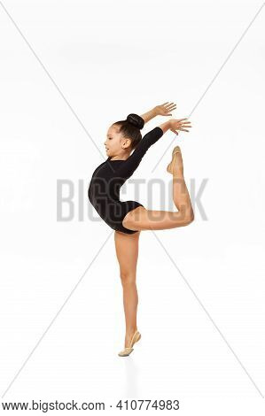 Young Flexible Slim Gymnast Girl In Gracefull Jump