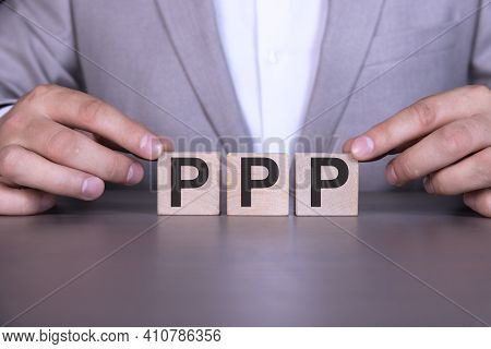 Paycheck Protection Program Ppp, The Word Is Written On Wooden Cubes, Blocks On The Background Of A 