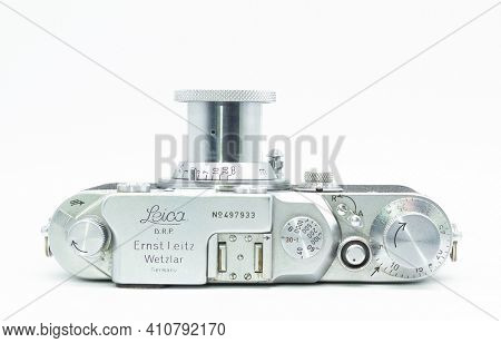DUSSELDORF, GERMANY - FEBRUARY, 2021: Top view of famous 35mm film camera Leica IIIc isolated on white background