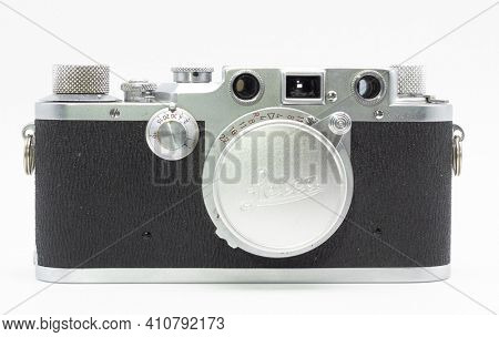 DUSSELDORF, GERMANY - FEBRUARY, 2021: Famous 35mm film camera Leica IIIc isolated on white background