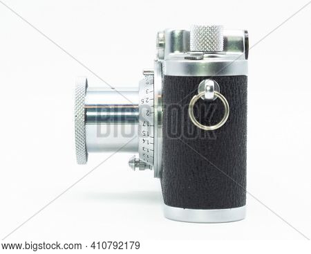 DUSSELDORF, GERMANY - FEBRUARY, 2021: Side view of famous 35mm film camera Leica IIIc isolated on white background
