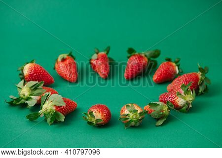 Fresh Red Strawberries On The Green Background