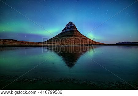 Northern Light (aurora Borealis) Over Kirkjufell Mountain In Iceland