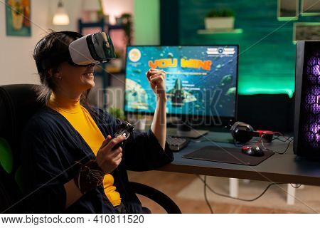 Winner Player Holding Console Playing Virtual Reality Videogame In Gaming Home Romm. Professional Pr