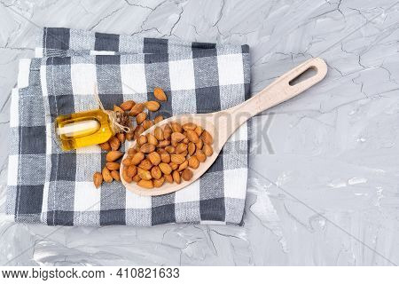 Bottle Of Apricot Seed Oil Prunus Armeniaca Oleum On A Concrete Background