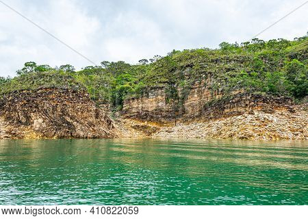 Rock Walls Of Canyons Of Furnas, Capitólio Mg, Brazil. Green Water Of The Lake And Sedimentary Rocks