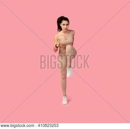 Tabata Routine, Bodyweight Workout. Full Body Length Front Shot Of Determined Sporty Young Lady Runn