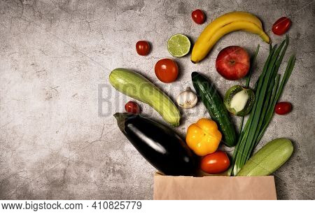 Healthy Lifestyle And Food Concept. Vegetables And Fruits Falling Out From Paper Pocket, Cucumber, T