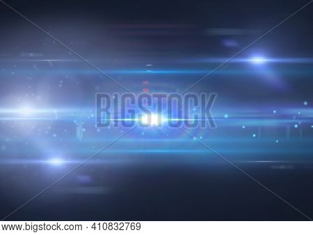 Glowing blue spots of light and light trails over blue background. light and colour concept digitally generated image.