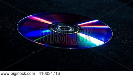 Cd Dvd Isolated On Black, Cd Dvd Background, Disk In The Dark