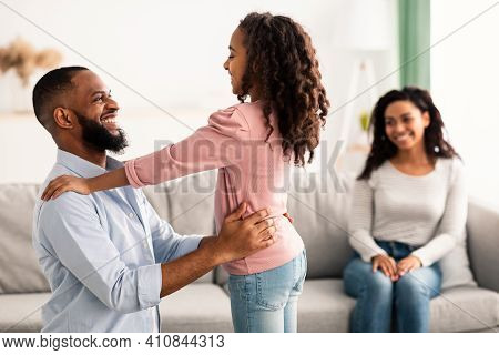 I Love You, Dad. Portrait Of African American Daughter Embarcing Man And Greeting Him With Fathers D