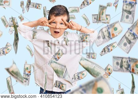 Cute blond kid wearing elegant shirt doing peace symbol with fingers over face, smiling cheerful showing victory