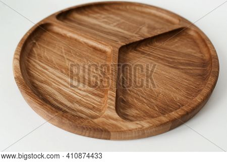 Compartmental Dish On A White Background. Dishes Made Of Natural Materials. Wooden Bowl.