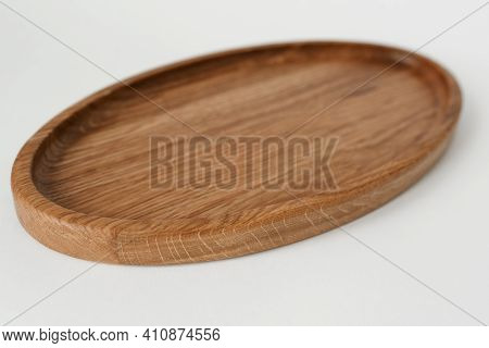 Wooden Oval Tray Large On White Background. Wooden Utensils On White Background. Dishes Made Of Natu