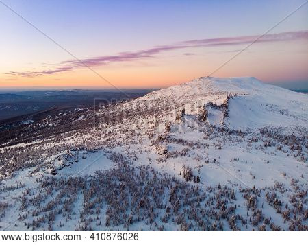 Colorful Winter Sunset In Sheregesh Ski Resort Mountains With Clouds. Aerial Top View Forest Russia