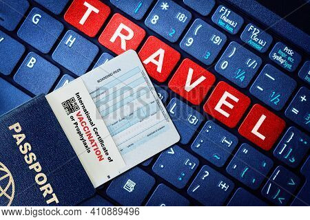 Passport, Boarding Pass And Certificate Of Covid-19 Vaccination On Keyboard With Travel On Red Keys.