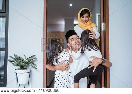 Excited Father Hug And Embrace His Children During Eid Mubarak Celebration