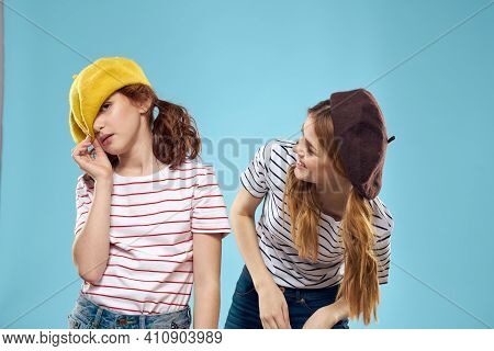 Fashion Sisters In Hats Fun Lifestyle Blue Background Studio