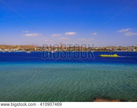 Panorama Of Sharm El-maya Bay With A Yellow Tourist Boat In The Turquoise-azure Water Of The Red Sea