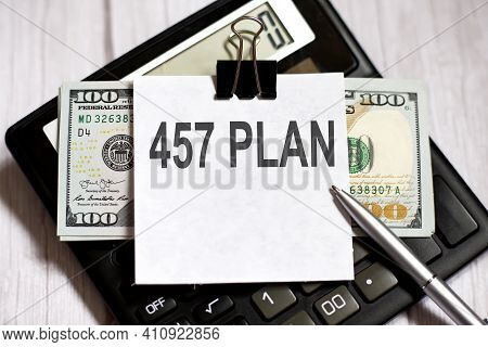 White Paper With Text 457 Plan With Dollars On The Calculator With Pen