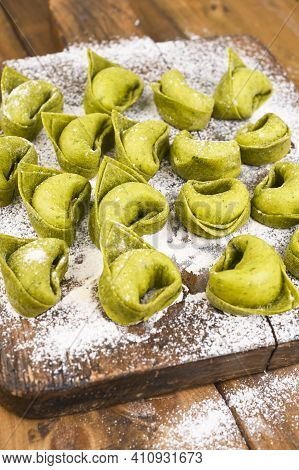 Tortellini E Tortelloni Typical Dishes Emilia Italy. Food Background With Homemade Raw Italian Torte