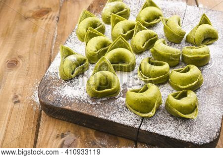 Tortellini E Tortelloni Typical Dishes Emilia Italy. Food Background With Homemade Raw Italian Torte