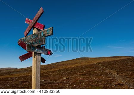 Path To Mount Njulla With Signpost At The Crossroads. Northern Sweden