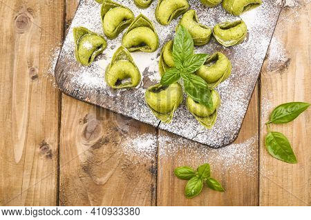 Tortellini E Tortelloni Typical Dishes Emilia Italy. Food Background With Homemade Raw Italian Torte