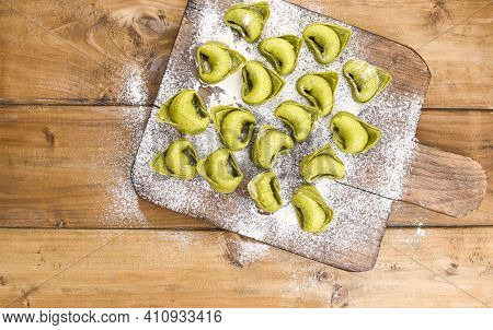 Tortellini E Tortelloni Typical Dishes Emilia Italy. Food Background With Homemade Raw Italian Torte