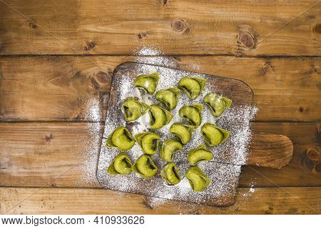 Tortellini E Tortelloni Typical Dishes Emilia Italy. Food Background With Homemade Raw Italian Torte