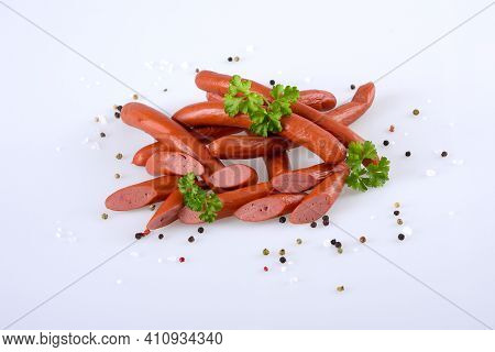 Smoked Pork Sausages, Grill Sausages, Isolated On White Background With Scattered Pepper.