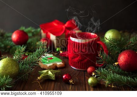Hot Christmas Tea With Gingerbread Cookie On Wooden Table. Top View. New Year And Christmas Celebrat