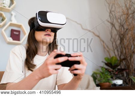A Person Plays A Joystick In A Game Of Virotic Reality. Cyber Gaming