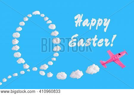 Pink Airplane Goes Into A Turn On Blue Background With Text Happy Easter And Easter Egg Of Abstract 