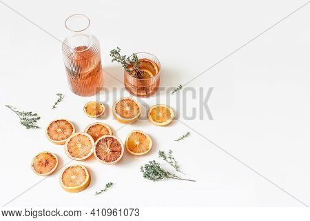 Fresh Blood Oranges Pattern. Whole And Cut Fruits With Thyme Herb Isolated On White Table Background