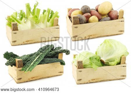 Assorted cooking vegetables in a wooden crate on a white background