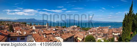 Panoramic view of Desenzano del Garda, a resort town on the shore of Lake Garda in Northern Italy. Lake Garda is the largest lake in Italy and a popular holiday location on the edge of the Dolomites