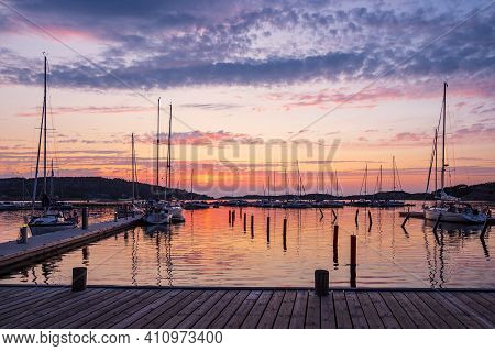 Sunset In The Port Of Fjaellbacka In Sweden.