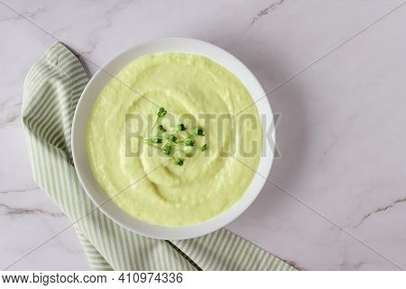 Top View On Classic French Chilled Cream Soup Vichyssoise - Warm Or Cold Potato Leek Soup Topped Wit